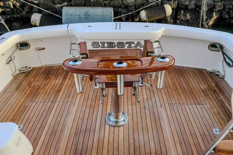 Slide: The Image of 2017 Viking 37 Billfish boat deck with wooden flooring and fishing chair. - 4