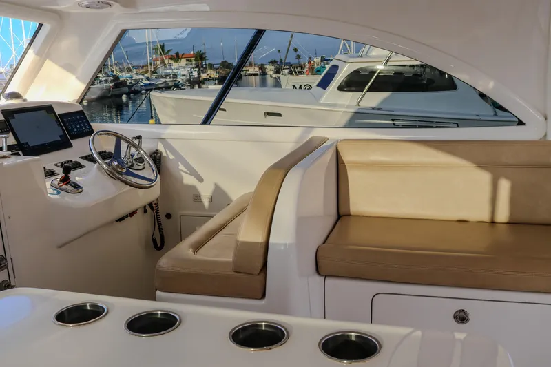 Slide: The Image of Interior of 2017 Viking 37 Billfish yacht with helm and seating area. - 8