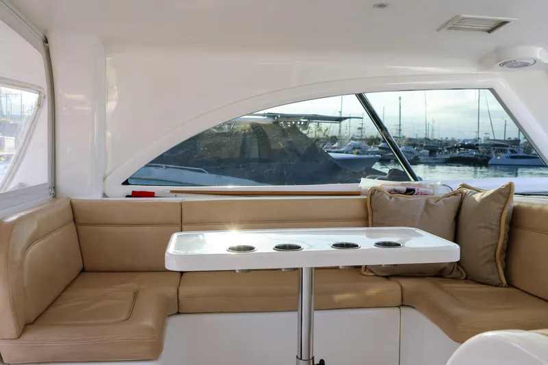 Slide: The Image of Luxurious interior of 2017 Viking 37 Billfish yacht with beige seating and marina view. - 9