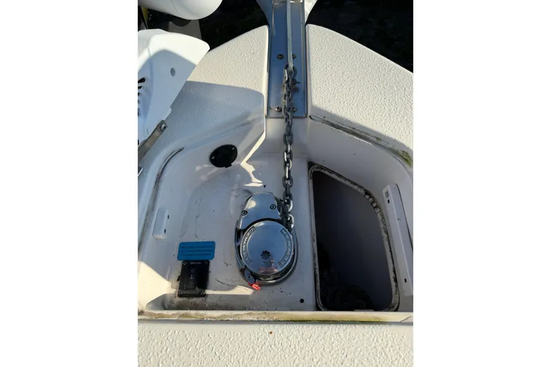 Slide: The Image of 2019 Sea Chaser 24 HFC boat anchor compartment with chain and winch. - 10