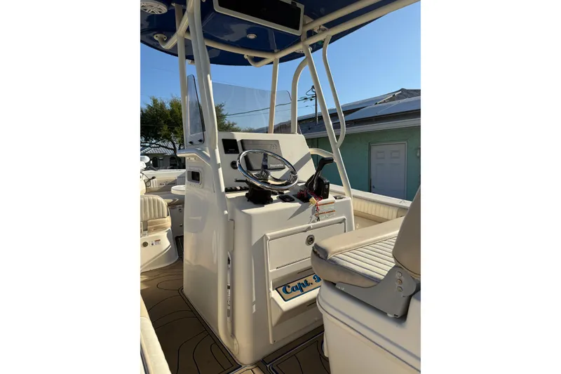 Slide: The Image of 2019 Sea Chaser 24 HFC boat console with steering wheel and seating. - 3