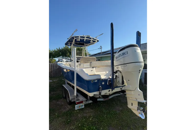 Slide: The Image of 2019 Sea Chaser 24 HFC boat with Suzuki outboard motor on trailer. - 4