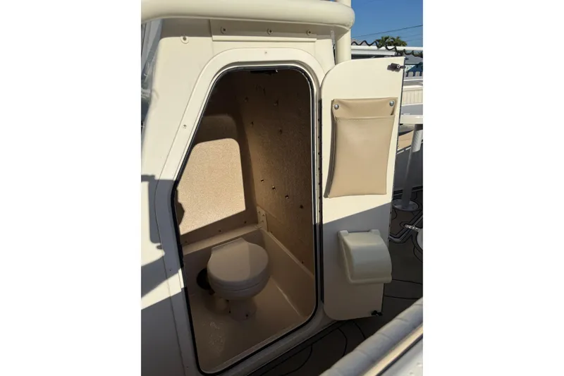 Slide: The Image of 2019 Sea Chaser 24 HFC boat interior with compact marine toilet. - 7