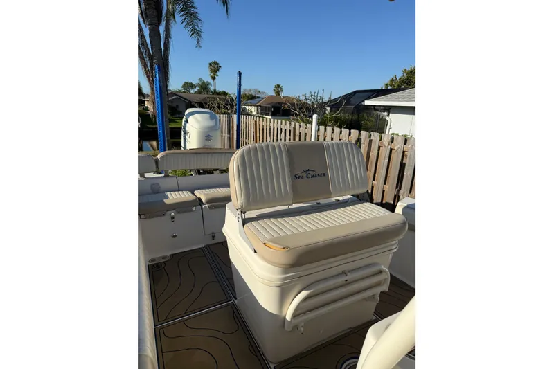 Slide: The Image of 2019 Sea Chaser 24 HFC boat interior with seating and deck view. - 8