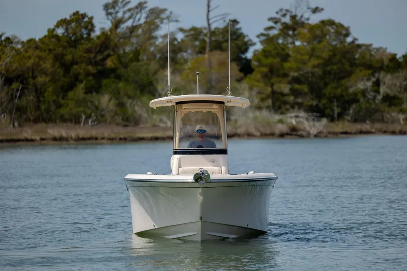 Slide: The Image of 2024 Grady-White Fisherman 236 boat cruising on a calm waterway. - 10