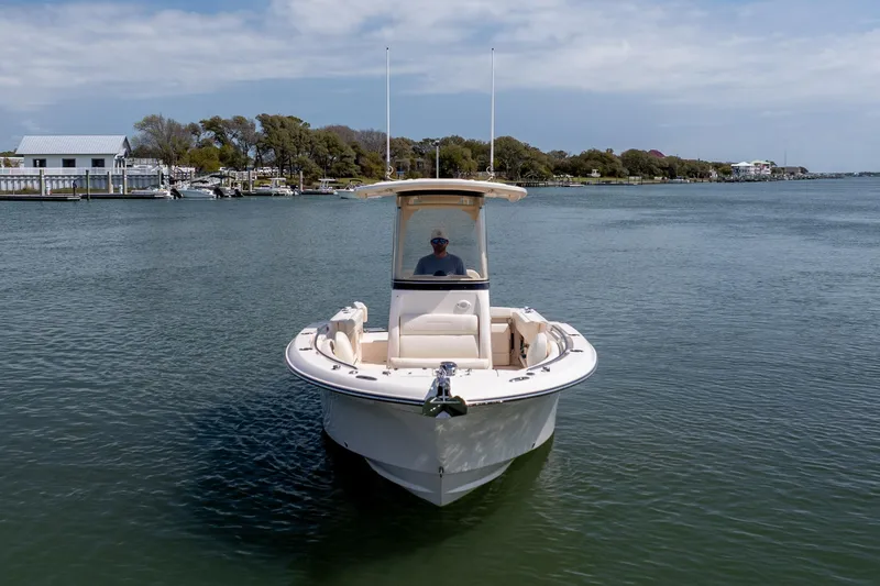 Slide: The Image of 2024 Grady-White Fisherman 236 boat on calm water, scenic background. - 12
