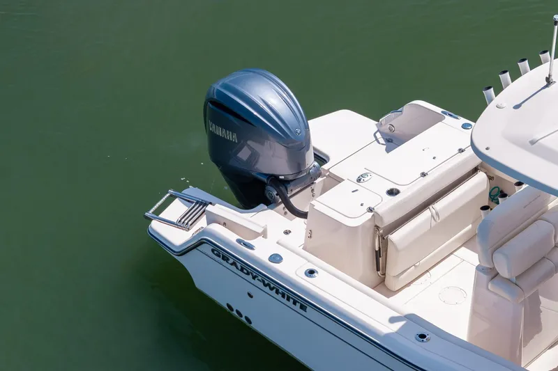 Slide: The Image of 2024 Grady-White Fisherman 236 boat with Yamaha outboard engine on calm water. - 14