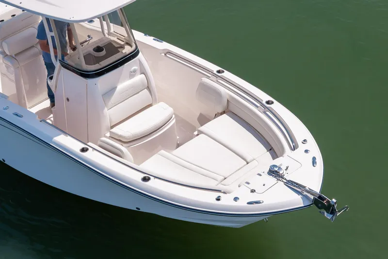 Slide: The Image of 2024 Grady-White Fisherman 236 boat with sleek design and spacious seating on calm water. - 15