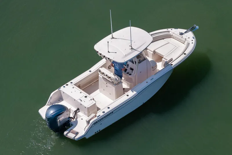 Slide: The Image of 2024 Grady-White Fisherman 236 boat on calm water, aerial view. - 16