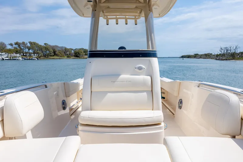 Slide: The Image of 2024 Grady-White Fisherman 236 boat interior, featuring comfortable seating and scenic water view. - 25