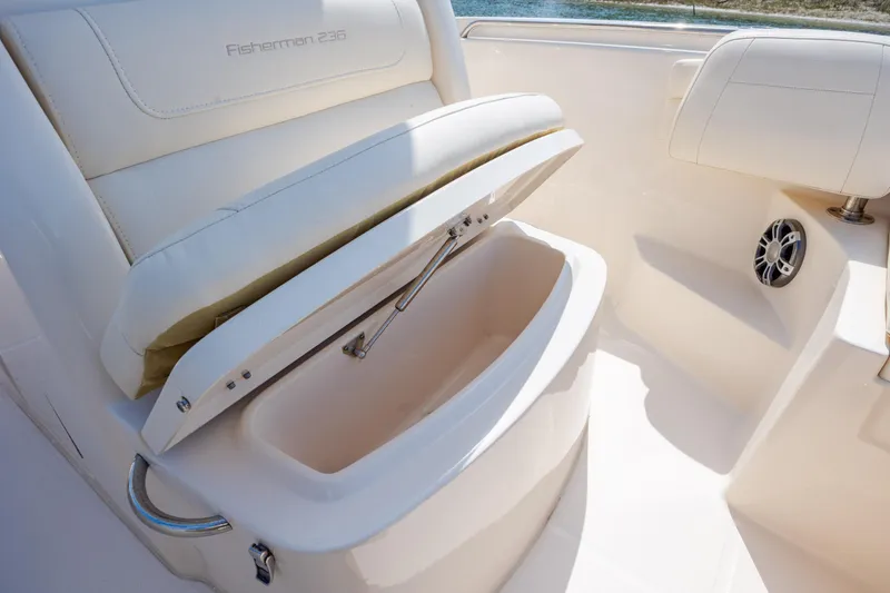 Slide: The Image of 2024 Grady-White Fisherman 236 boat seat with storage compartment open. - 26
