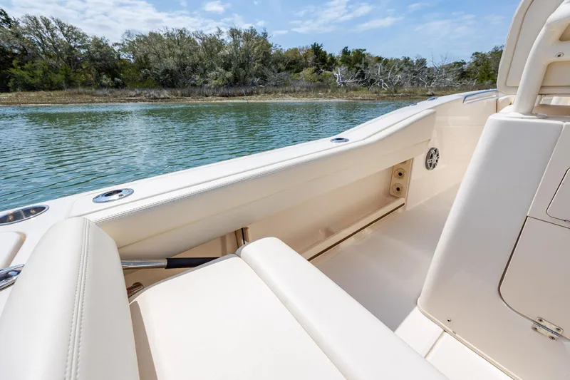 Slide: The Image of 2024 Grady-White Fisherman 236 boat interior with sleek seating and scenic water view. - 44