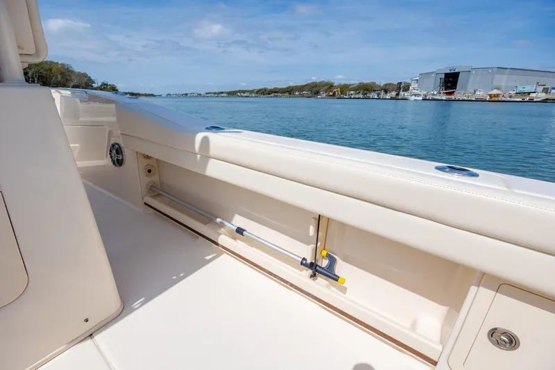 Slide: The Image of 2024 Grady-White Fisherman 236 boat interior with rod storage, dockside view. - 45