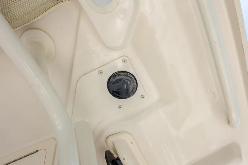 Slide: The Image of 2024 Grady-White Fisherman 236 boat detail, featuring a recessed compartment with a black cover. - 49