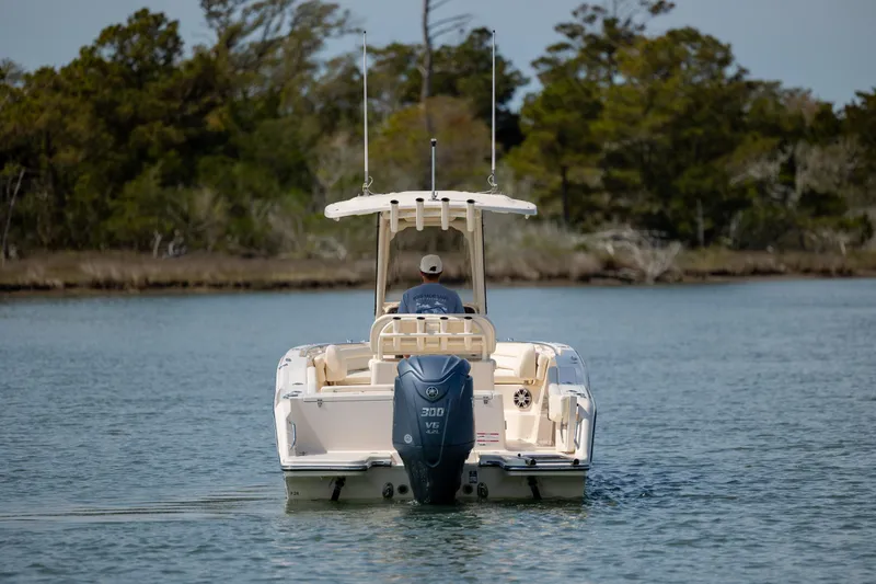 Slide: The Image of 2024 Grady-White Fisherman 236 boat cruising on a calm lake. - 5