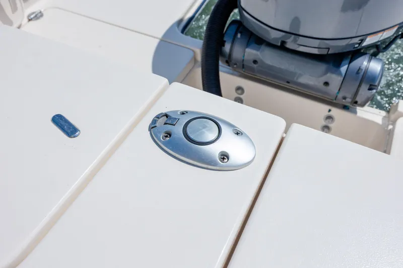 Slide: The Image of 2024 Grady-White Fisherman 236 boat detail with engine and deck features. - 52