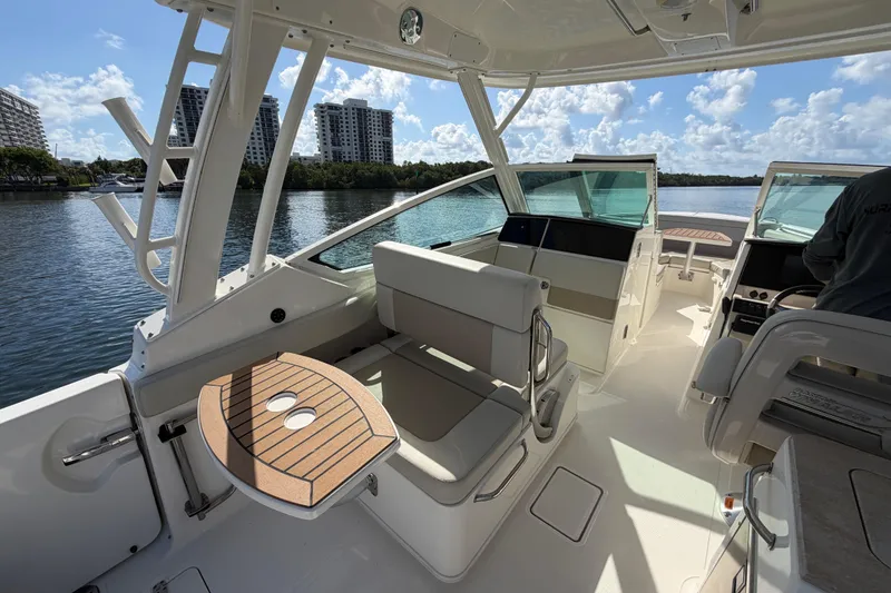 Slide: The Image of 2021 Boston Whaler 280 Vantage interior with seating and water view. - 10