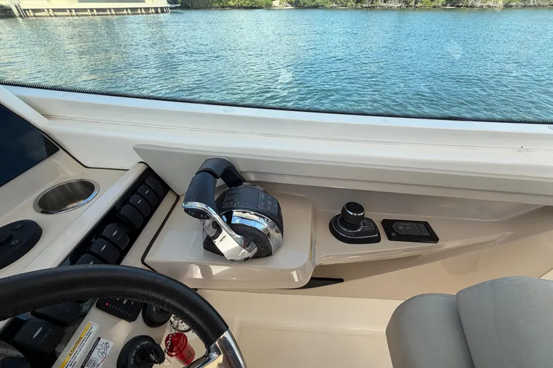 Slide: The Image of 2021 Boston Whaler 280 Vantage helm with controls and water view. - 22