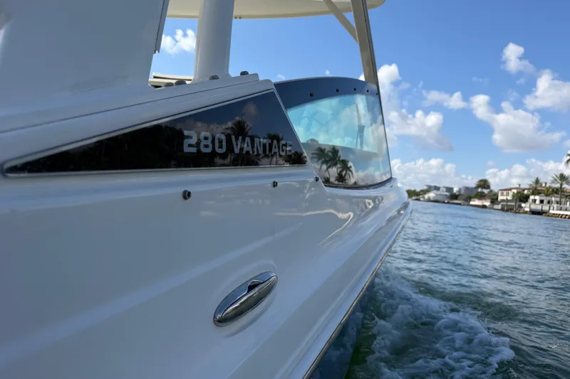 Slide: The Image of 2021 Boston Whaler 280 Vantage cruising on a sunny day with clear skies. - 27