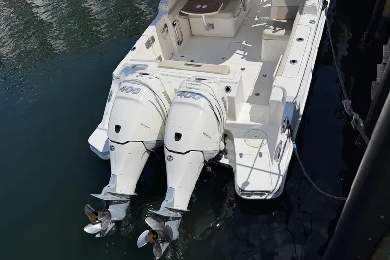 Slide: The Image of 2021 Boston Whaler 280 Vantage with dual Mercury 400 engines docked in water. - 42