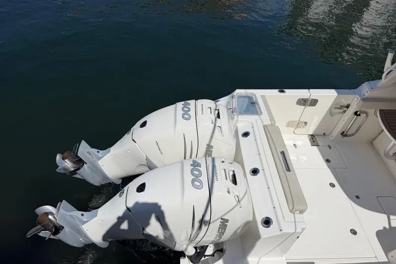 Slide: The Image of 2021 Boston Whaler 280 Vantage with twin 400 horsepower outboard engines on water. - 43