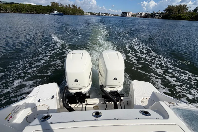 Slide: The Image of Boston Whaler 280 Vantage 2021 cruising on a scenic waterway with twin engines. - 9