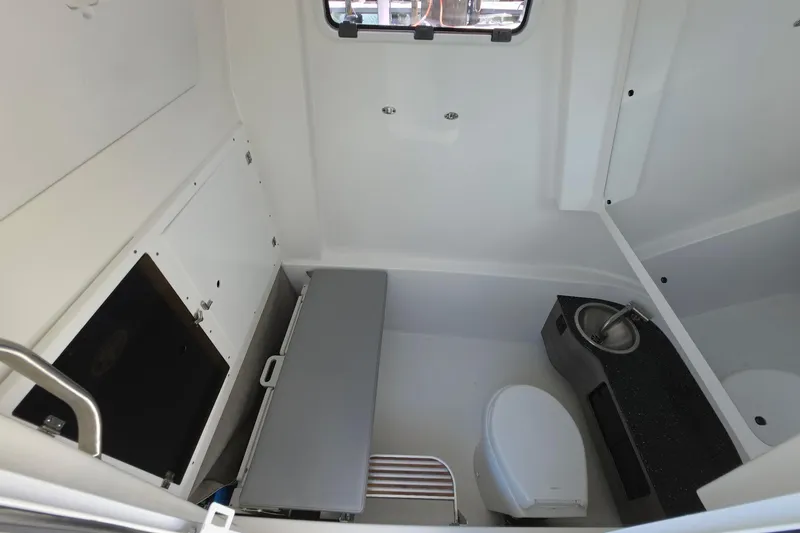 Slide: The Image of 2024 Sea Pro 322 Offshore cabin interior with toilet and sink. - 11