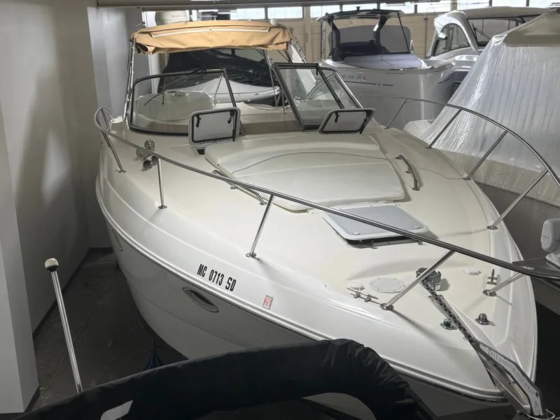 Slide: The Image of 2001 Larson Cabrio 330 boat in storage facility. - 12