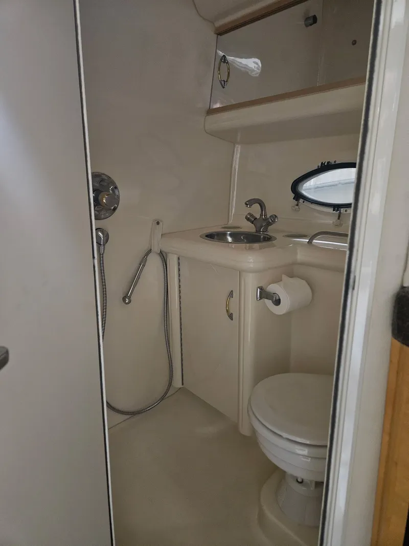 Slide: The Image of Bathroom in 2001 Larson Cabrio 330 boat. - 17