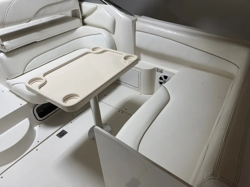 Slide: The Image of Interior of 2001 Larson Cabrio 330 yacht with table and seating area. - 3