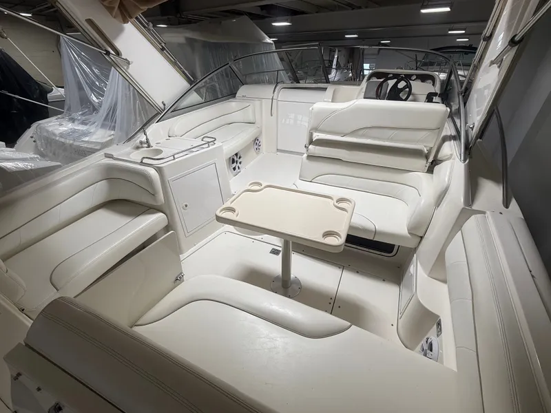 Slide: The Image of Interior of a 2001 Larson Cabrio 330 yacht with white leather seating. - 5