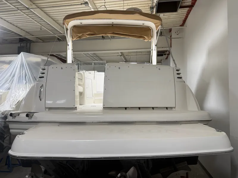 Slide: The Image of 2001 Larson Cabrio 330 boat stored in a warehouse. - 7