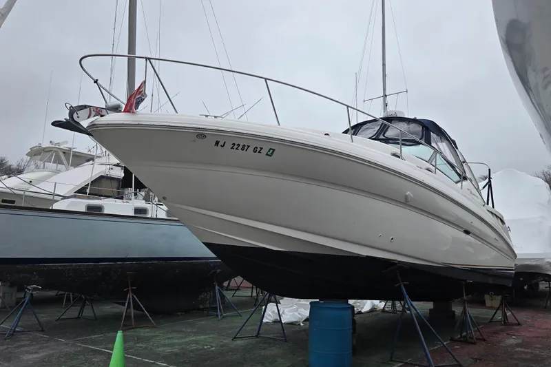 The Image of 2003 Sea Ray Sundancer 320 yacht on stands, ready for maintenance. - 0