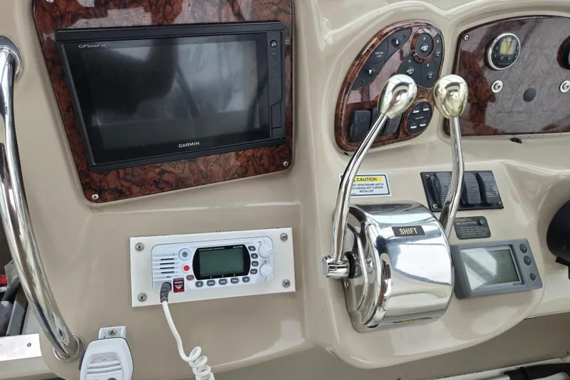 Slide: The Image of Control panel of a 2003 Sea Ray Sundancer 320 with Garmin GPS and radio equipment. - 14