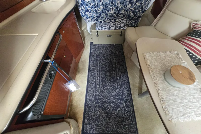 Slide: The Image of Interior of 2003 Sea Ray Sundancer 320 with elegant seating, table, and cabinetry. - 19