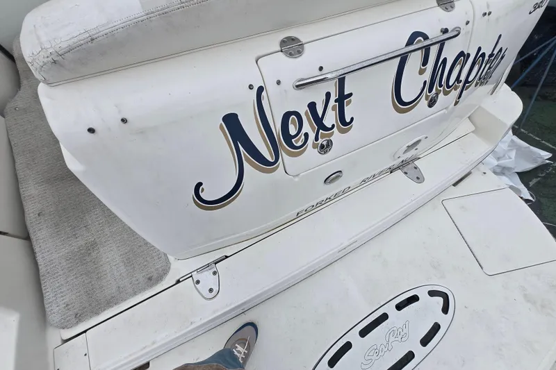 Slide: The Image of 2003 Sea Ray Sundancer 320 boat with "Next Chapter" name on the stern. - 26