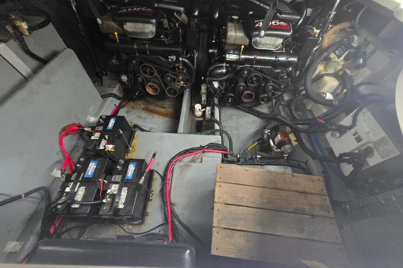 Slide: The Image of Engine compartment of a 2003 Sea Ray Sundancer 320 with dual engines and battery setup. - 29