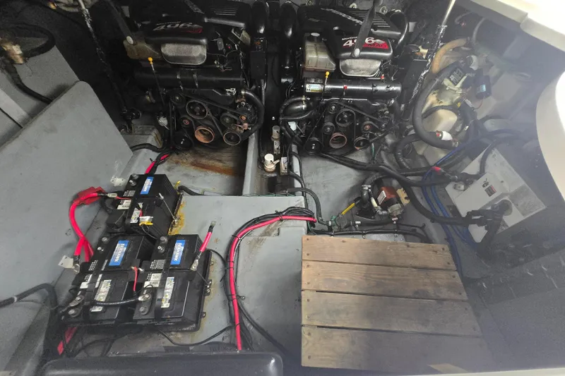 Slide: The Image of Engine compartment of a 2003 Sea Ray Sundancer 320 with batteries and wiring. - 30