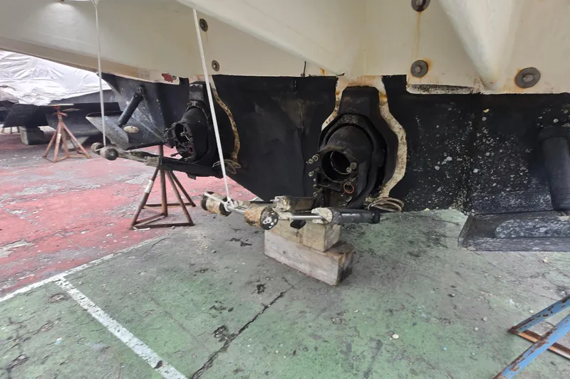 Slide: The Image of 2003 Sea Ray Sundancer 320 undergoing maintenance, showing exposed stern drive components. - 31