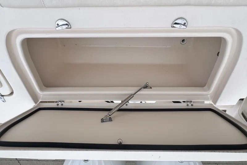 Slide: The Image of Open storage compartment on 2023 Grady-White Freedom 285 boat. - 12