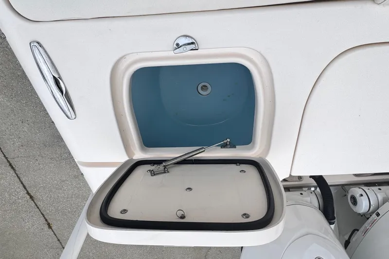 Slide: The Image of Open storage compartment on 2023 Grady-White Freedom 285 boat. - 13