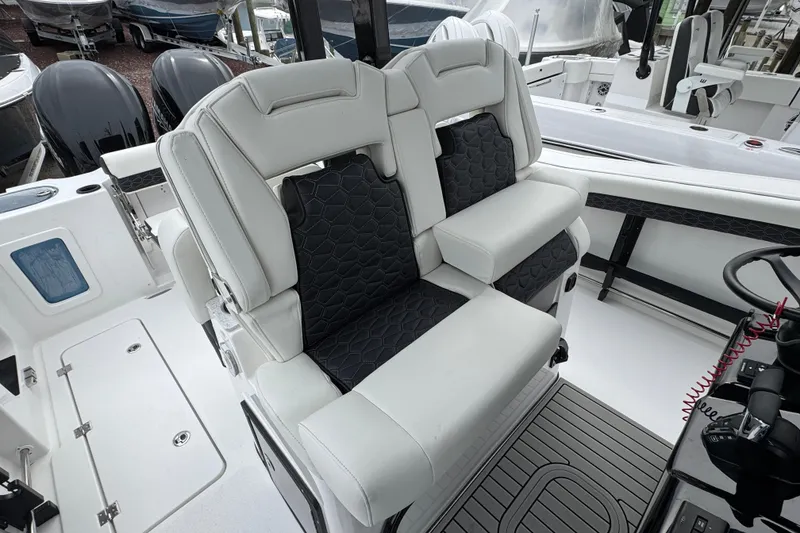 Slide: The Image of 2026 Tidewater 302 CC Adventure boat interior with luxurious seating and modern design. - 10