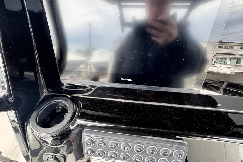 Slide: The Image of Console of 2026 Tidewater 302 CC Adventure with Garmin display and control panel. - 17