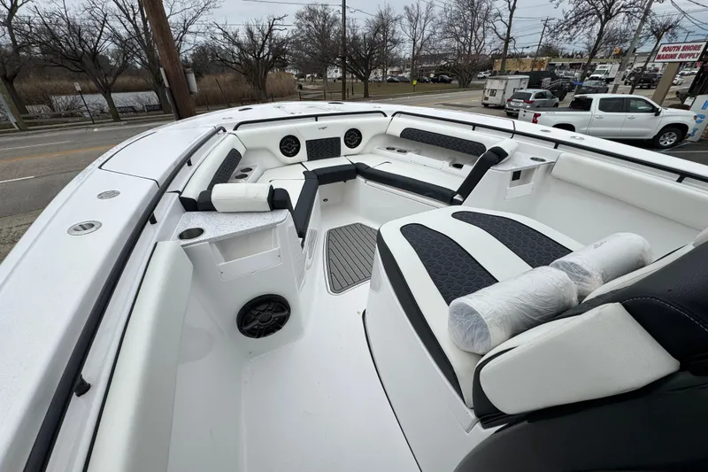 Slide: The Image of 2026 Tidewater 302 CC Adventure boat interior with cushioned seating and modern design. - 20