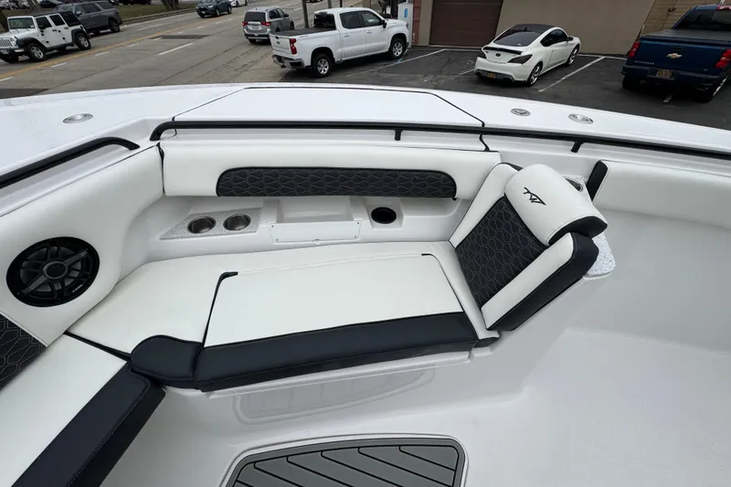 Slide: The Image of Luxurious seating on 2026 Tidewater 302 CC Adventure boat, featuring cup holders and speaker. - 23