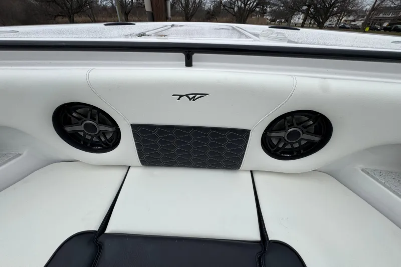 Slide: The Image of Interior of 2026 Tidewater 302 CC Adventure boat with speakers and stylish upholstery. - 26