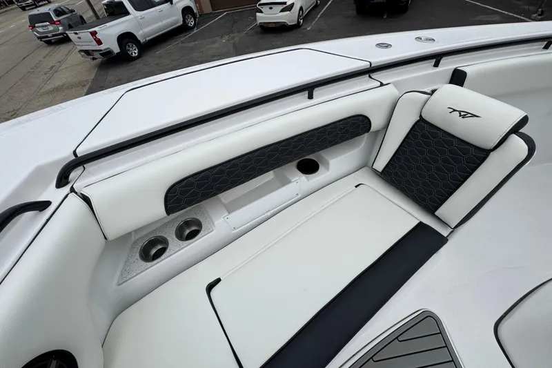 Slide: The Image of 2026 Tidewater 302 CC Adventure boat interior with white and black seating. - 28