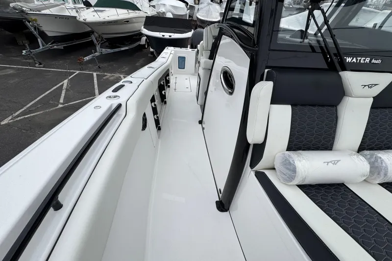 Slide: The Image of 2026 Tidewater 302 CC Adventure boat interior with sleek seating and modern design. - 29