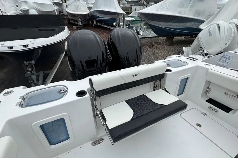 Slide: The Image of 2026 Tidewater 302 CC Adventure boat with dual Yamaha engines, featuring sleek seating and modern design. - 4