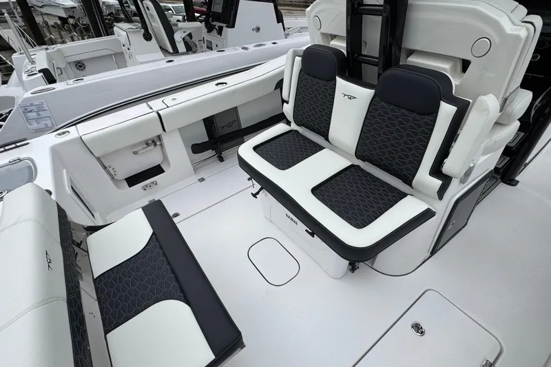 Slide: The Image of 2026 Tidewater 302 CC Adventure boat interior with stylish seating and modern design. - 5